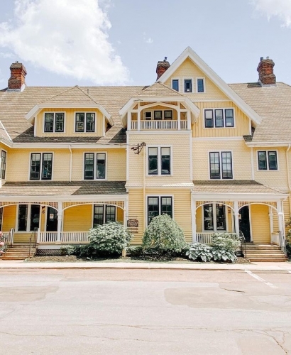 Historic yellow heritage home with Victorian architecture in downtown Charlottetown, Prince Edward Island