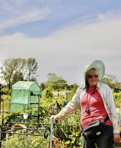 Women planting flowers and gardening in Legacy Garden in Charlottetown, Prince Edward Island, during the growing season.