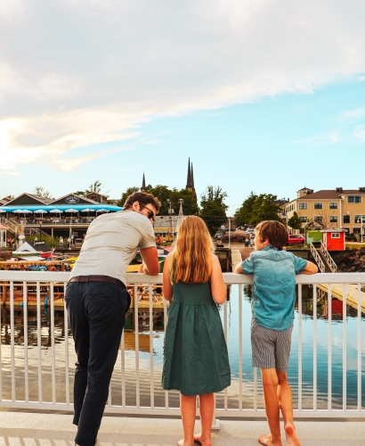 A family relaxing on the floating dock at Peake's Quay Marina in Charlottetown, Prince Edward Island, during the summer.