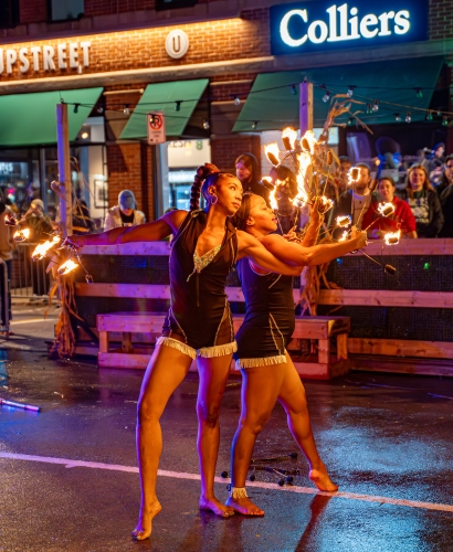 Fire dancer performing at a street feast festival in Charlottetown, Prince Edward Island at night