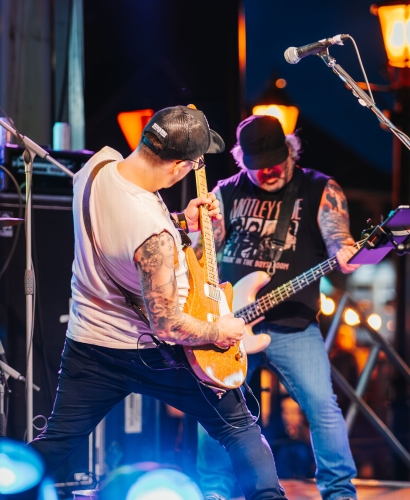Live music performance by two artists on stage in downtown Charlottetown during street feast