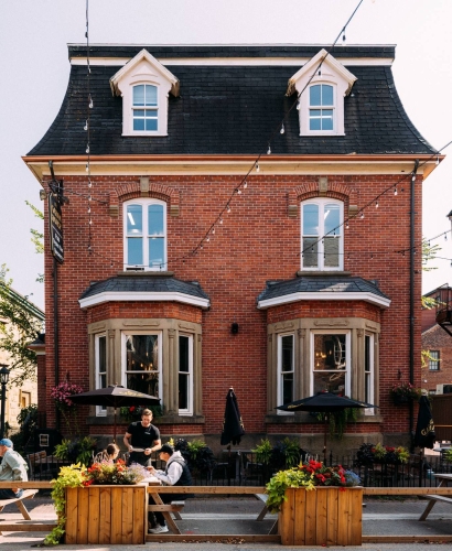 Guests dining on the outdoor patio at Gahan House in downtown Charlottetown, Prince Edward Island.