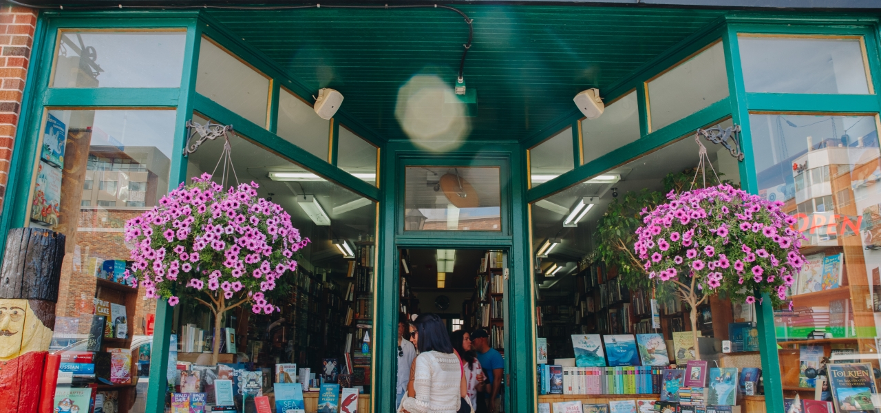 Interior of The Bookman bookstore in Charlottetown, Prince Edward Island, with shelves filled with books and a cozy browsing atmosphere.