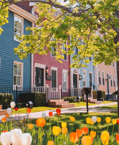 The Great George Hotel on Great George Street in Charlottetown, Prince Edward Island, with spring tulips and eco-friendly housekeeping opt-out program