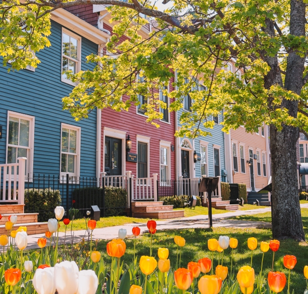 The Great George Hotel on Great George Street in Charlottetown, Prince Edward Island, with spring tulips and eco-friendly housekeeping opt-out program